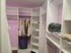 Large walk-in closet with custom shelving and rods at 6895 Se 96Th Place Rd, Belleview, FL 34420