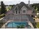 Aerial view of house, pool, and surrounding landscape at 6895 Se 96Th Place Rd, Belleview, FL 34420