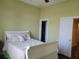 Bedroom with a full-size bed, and neutral decor at 6895 Se 96Th Place Rd, Belleview, FL 34420