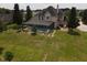 Aerial view showcasing the house's rear, pool, and landscape at 6895 Se 96Th Place Rd, Belleview, FL 34420