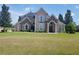 Two story house with a large front yard and solar panels at 6895 Se 96Th Place Rd, Belleview, FL 34420