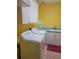 Bright laundry room with white cabinets, washer, and dryer at 6895 Se 96Th Place Rd, Belleview, FL 34420