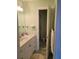 Bathroom with a shower, vanity and sink at 6895 Se 96Th Place Rd, Belleview, FL 34420