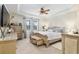 Bright main bedroom with a king-size bed and ample closet space at 6701 Sw 94Th Cir, Ocala, FL 34481