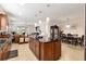 Modern kitchen with large island and stainless steel appliances at 6701 Sw 94Th Cir, Ocala, FL 34481