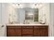 Double vanity bathroom with a large mirror and good lighting at 6701 Sw 94Th Cir, Ocala, FL 34481