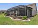 Expansive backyard with screened patio and lush landscaping at 6701 Sw 94Th Cir, Ocala, FL 34481