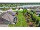 Aerial view showcasing home, backyard and community lake at 6701 Sw 94Th Cir, Ocala, FL 34481