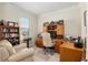 Home office with built-in desk and ample shelving at 6701 Sw 94Th Cir, Ocala, FL 34481