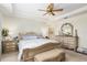 Large main bedroom with a king-size bed and ensuite bathroom access at 6701 Sw 94Th Cir, Ocala, FL 34481