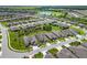 Aerial view of a beautiful community with houses and a lake at 6701 Sw 94Th Cir, Ocala, FL 34481
