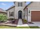 Front entry of two-story house with stone veneer and screen door at 6701 Sw 94Th Cir, Ocala, FL 34481