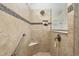Spacious bathroom with walk-in shower, built-in seat, and grab bar at 6701 Sw 94Th Cir, Ocala, FL 34481