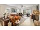 Comfortable living room featuring leather sofas and access to backyard patio at 6701 Sw 94Th Cir, Ocala, FL 34481