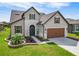 Two-story house with brown garage door and landscaped yard at 6701 Sw 94Th Cir, Ocala, FL 34481