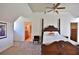 Spacious bedroom with a large wooden bed frame and an ensuite bathroom at 1321 Sw 42Nd St, Ocala, FL 34471