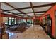 Spacious game room with a built-in bar and red walls at 1321 Sw 42Nd St, Ocala, FL 34471