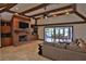 Open living room with a brick fireplace and high ceilings at 1321 Sw 42Nd St, Ocala, FL 34471