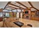 Large living room with exposed beams and a sectional sofa at 1321 Sw 42Nd St, Ocala, FL 34471