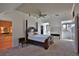 Bright bedroom with a wooden bed frame, built-in dresser, and window seat at 1321 Sw 42Nd St, Ocala, FL 34471
