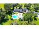 Luxury home with pool and gazebo, surrounded by lush landscaping at 1321 Sw 42Nd St, Ocala, FL 34471