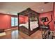 Main bedroom with large four poster bed and exercise equipment at 1321 Sw 42Nd St, Ocala, FL 34471