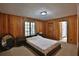 Bedroom with wood paneled walls and ensuite bathroom at 1321 Sw 42Nd St, Ocala, FL 34471