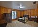 Bedroom with wood paneled walls and antique furniture at 1321 Sw 42Nd St, Ocala, FL 34471