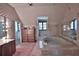 Bathroom featuring a large vanity, soaking tub, and ample storage at 1321 Sw 42Nd St, Ocala, FL 34471
