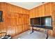 Home office with wood paneled walls and large monitors at 1321 Sw 42Nd St, Ocala, FL 34471