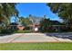 Brick home with a large driveway and mature trees at 1321 Sw 42Nd St, Ocala, FL 34471