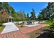 Inviting pool area with brick patio, gazebo, and lush landscaping at 1321 Sw 42Nd St, Ocala, FL 34471