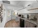 Small kitchen with mini-fridge, microwave and cooktop at 14181 Se 211Th Court, Umatilla, FL 32784