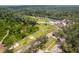 Aerial view of a vast property with various buildings and landscaping at 14181 Se 211Th Court, Umatilla, FL 32784