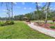 Landscaped backyard with picnic table and walking path at 14181 Se 211Th Court, Umatilla, FL 32784