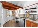 Small kitchenette with wood accents, modern appliances, and a rustic design at 14181 Se 211Th Court, Umatilla, FL 32784