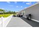 Spacious deck with seating area, grill, and backyard views at 14181 Se 211Th Court, Umatilla, FL 32784