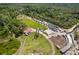 Aerial view of property with buildings and pool at 14181 Se 211Th Court, Umatilla, FL 32784