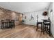 Game room with wood flooring, bar area and seating at 14181 Se 211Th Court, Umatilla, FL 32784