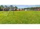 Large grassy yard with soccer goal and cabins in the background at 14181 Se 211Th Court, Umatilla, FL 32784
