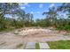 Empty pool excavation on a wooded lot at 14181 Se 211Th Court, Umatilla, FL 32784