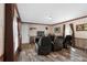 Relaxing living room with two comfortable recliner chairs and wood-look floors at 14181 Se 211Th Court, Umatilla, FL 32784