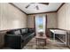 Office space with a sofa, coffee table, and a view of the backyard at 14181 Se 211Th Court, Umatilla, FL 32784