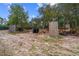 Wooded lot with tire and wood barriers, ideal for recreational activities at 14181 Se 211Th Court, Umatilla, FL 32784