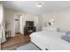 Main bedroom with a queen bed, built-in shelving, and access to a full bathroom at 14181 Se 211Th Court, Umatilla, FL 32784