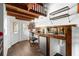 Rustic kitchenette features wood countertops and a small refrigerator at 14181 Se 211Th Court, Umatilla, FL 32784