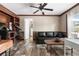 Home office with a built-in bookcase, desk, and comfortable seating at 14181 Se 211Th Court, Umatilla, FL 32784