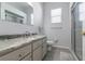 Clean bathroom with granite countertop and a walk-in shower at 2515 Nw 53Rd Avenue Rd, Ocala, FL 34482