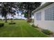 Landscaped backyard with golf course view and lush greenery at 2515 Nw 53Rd Avenue Rd, Ocala, FL 34482