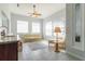 Sunroom with tiled floors, sofas, and a ceiling fan at 2515 Nw 53Rd Avenue Rd, Ocala, FL 34482